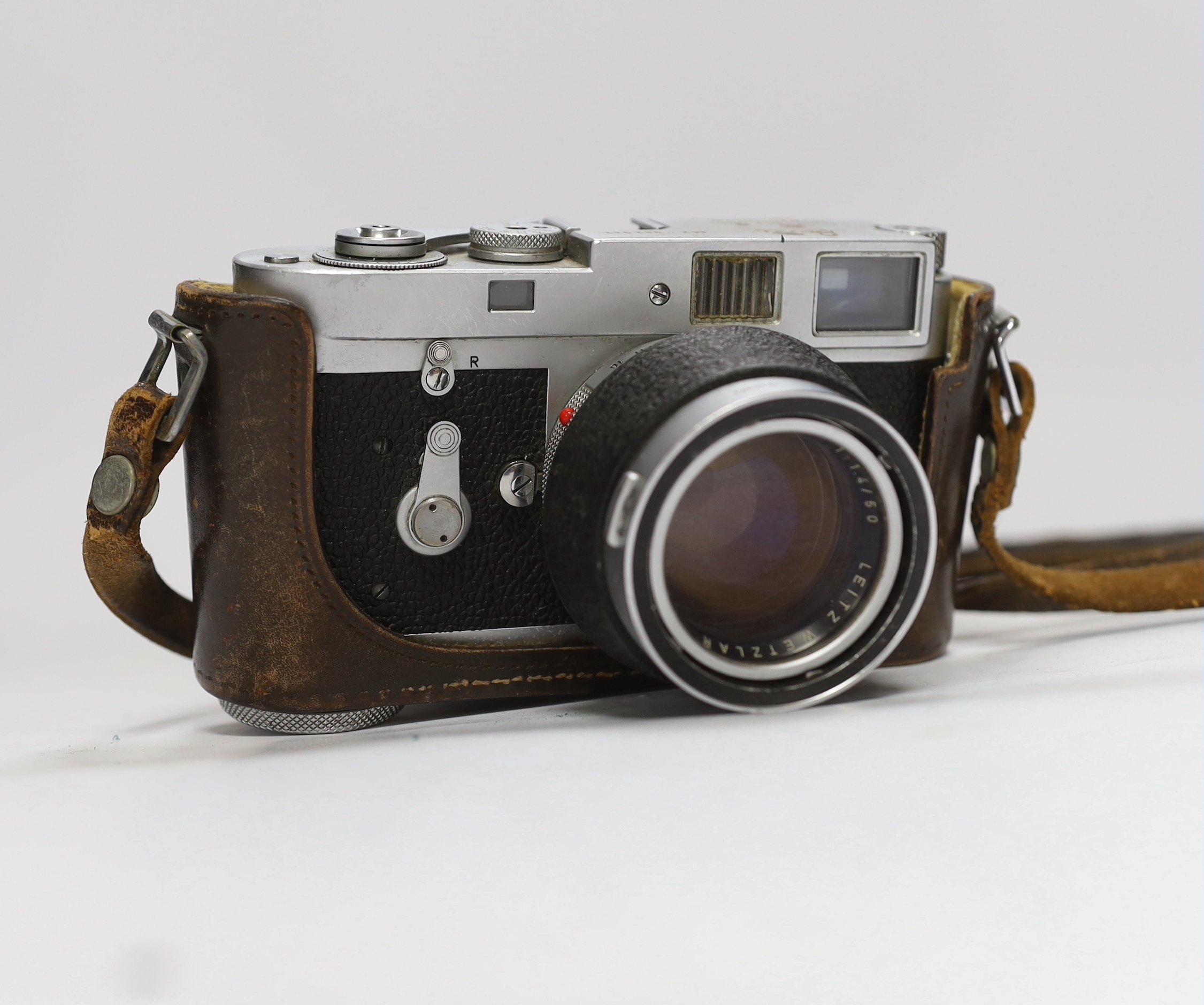 A Leica M2 camera, serial no. 982947, c. 1959, with Summilux 1:1. 4/50 lens, in leather case with strap